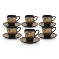 Black and gold ancient Egyptian coffee cup and saucer set featuring Queen Nefertiti profile portraits and hieroglyphic patterns