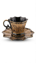 Ornate Egyptian cup and saucer