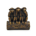 Bronze-finish Three Wise Monkeys figurine seated on a log marked "EGYPT"
