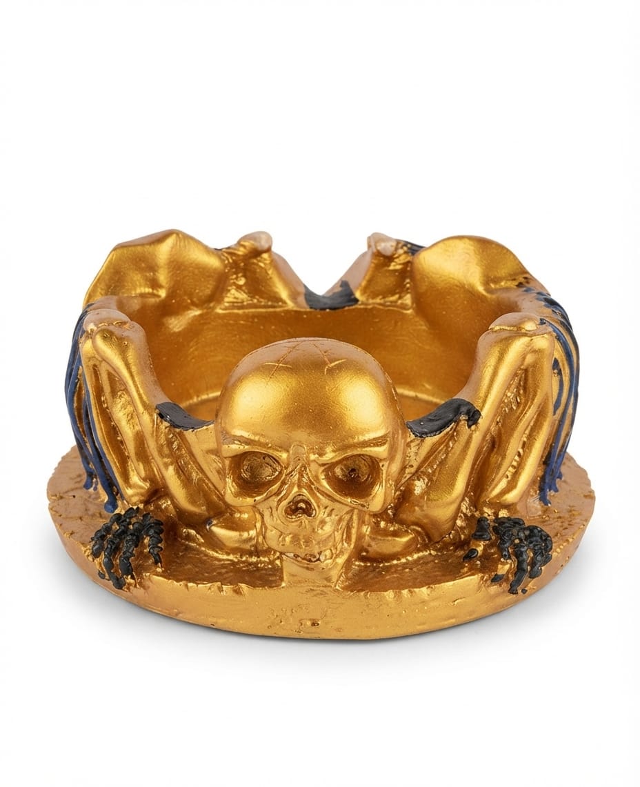 Gold skull dish/ashtray with skeletal wing accents