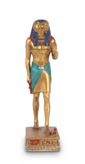Gold-finish Egyptian Horus falcon god standing figurine wearing a blue wig, patterned tunic, and holding ceremonial symbols on an inscribed pedestal