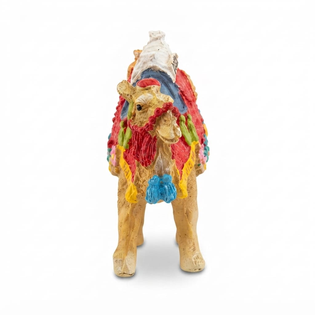 Colorful camel figurine with a decorated saddle and red-and-green blanket