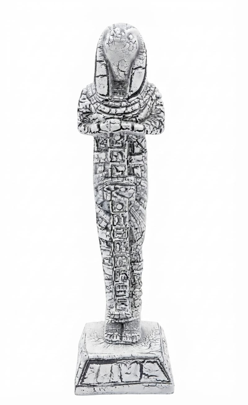 Weathered white and grey standing pharaonic mummy or shabti figurine with hieroglyphic panels on a square base