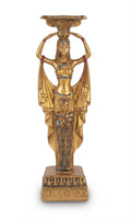 Gold-finish Egyptian goddess statue featuring an elaborate headdress supporting a chalice, draped wings, and a pharaonic motif embedded in the dress