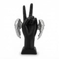 Black hand sculpture making a peace sign accented with textured silver angel wings on both sides
